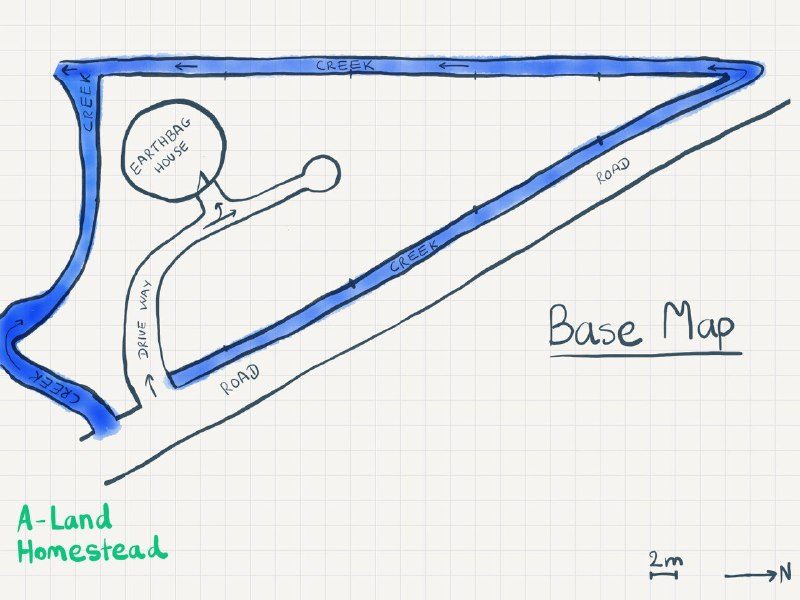 A hand-drawn map of the plot, with creeks along two sides and a road along the third